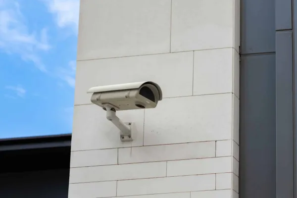 Technician mounting an HD surveillance camera — DigiCo Wiring, Los Angeles